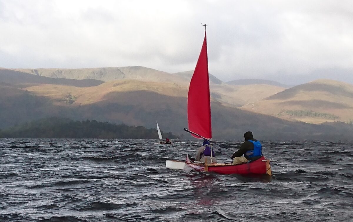 Sailing a canoe on Loch Lomond in quite a breeze with choppy water