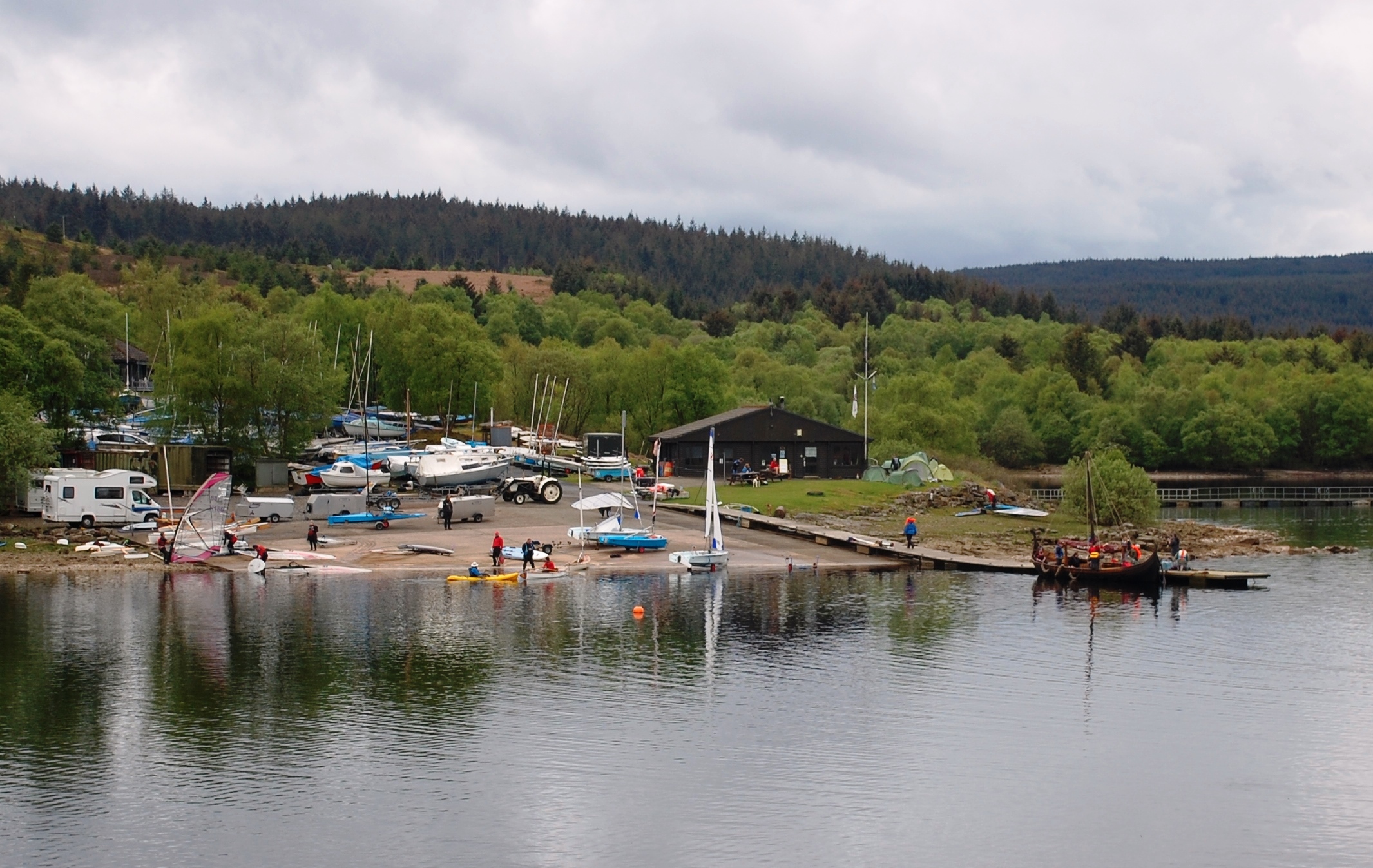 general scene of a sailing club on a lake